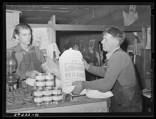 Unemployed miner with food from surplus commodities corporation. Zeigler, Illinois