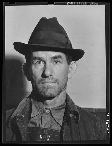 Unemployed miner, Herrin, Illinois. General caption: Williamson County, Illinois, once produced 11,000,000 tons of coal per year, and led the state in output. Since 1923, output has steadily declined until now it falls short of 2,000,000 tons. At one time, sixteen mine-whistles blowing to work could