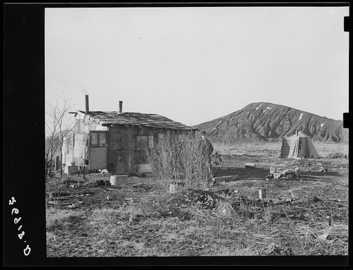 A shanty and tent on the city dump at Herrin, Illinois