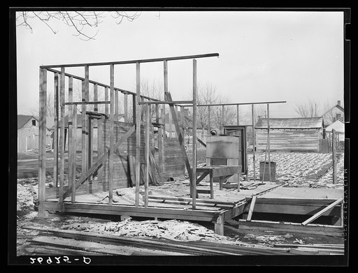 House being torn down for scrap lumber. Johnston City, Illinois