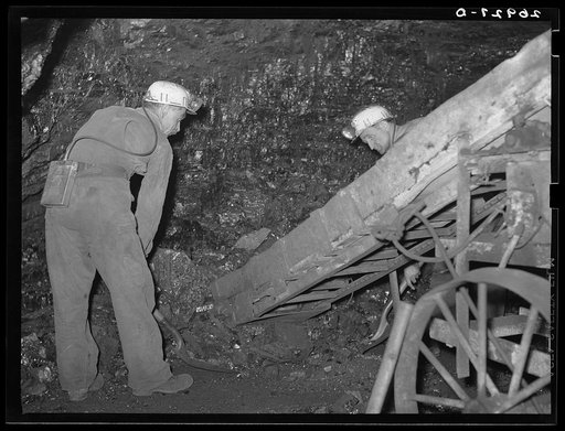 Shoveling coal into a conveyer loader, Old Ben number eight. West Frankfort, Illinois (see 26980-D)
