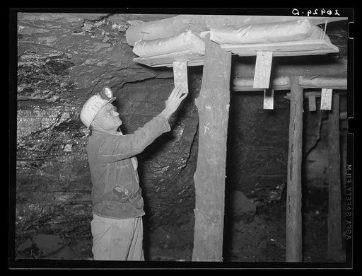 Safety engineer with rock dust traps to prevent spread of mine explosions. Old Ben number eight. West Frankfort, Illinois