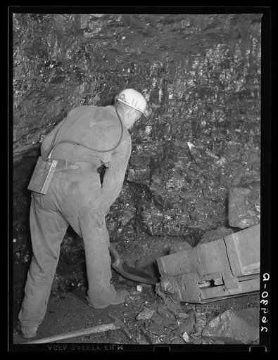 In pitcar loading, a man is required to shovel coal into the conveyer. Old Ben number eight. West Frankfort, Illinois (see 26980-D)