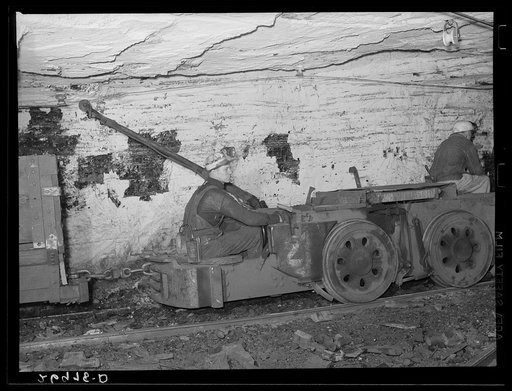 Powerful electric locomotives pull up to thirty cars loaded with coal through the entries of the mine. Old Ben number eight. West Frankfort, Illinois