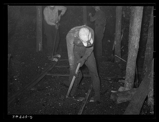 Untitled photo, possibly related to: Laying track in coal mine. Old Ben number eight mine. West Frankfort, Illinois