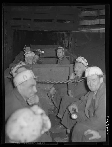 Underground at Old Ben number eight mine. These men are on a "man-trip" which goes three and half miles to the face of the coal. General caption: Most of the giant coal producers in Franklin Couny have completely mechanized underground operations. Old Ben number eight, because of shortage of working