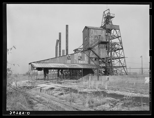 Consolidated Coal Company, Lake Creek Mine, Johnston City, Illinois. Abandoned. This mine will never work again. Williamson County, Illinois once produced 11,000,000 tons of coal a year and led the state in output. Since 1923, output has steadily declined until now it falls short of 2,000,000 tons. 