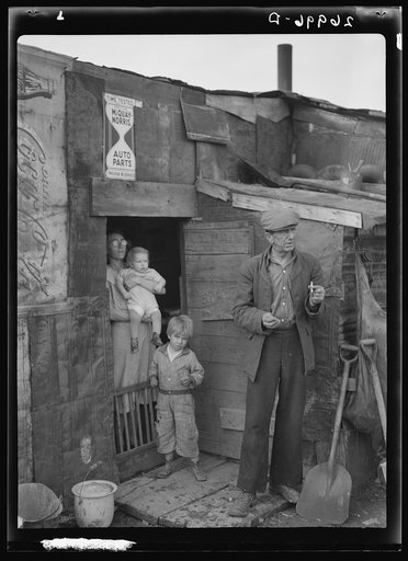 Family on relief living in shanty on city dump. Herrin, Illinois