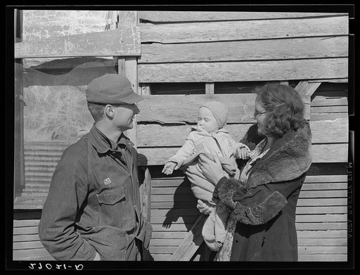 Untitled photo, possibly related to: Rehabilitation Administration client's wife and children. Gallatin County, Illinois. General caption: these photographs show the conditions under which a rehabilitation client of Gallatin County, Illinois lives, and how he has made use of the loan extended to him