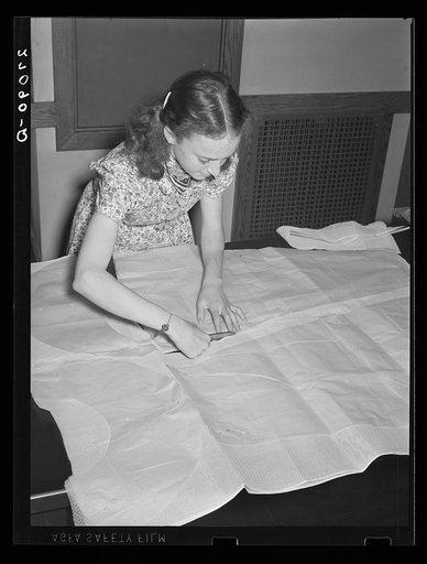 Cutting a pattern in sewing class. Greenbelt, Maryland