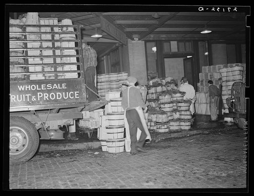 Loading green vegetables at produce market. Pier 29, New York City