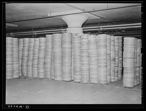 Stacks of cheese in cold storage warehouse, Jersey City, New Jersey, in "cooler room"