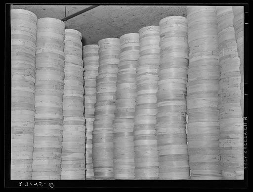 Stacks of cheeses in cold storage warehouse, Jersey City, New Jersey, kept in "cooler room"