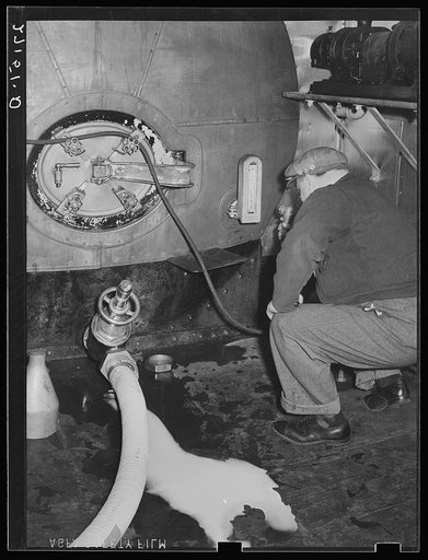Transferring milk from tank car to truck. Jersey City, New Jersey