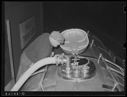 Transferring milk from tank car to truck. Jersey City, New Jersey