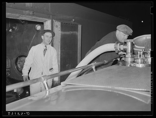 Untitled photo, possibly related to: Transferring milk from tank car to truck. Jersey City, New Jersey