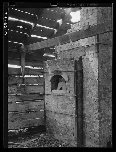 Furnace for converting gold dust into solid metal. Pony, Montana