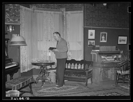 Charles Morris, one of the few remaining inhabitants of the ghost town of Pony, Montana. Some of the furniture was brought overland by wagon