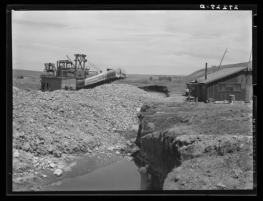 Tailing piles left by gold dredge. Madison County, Montana