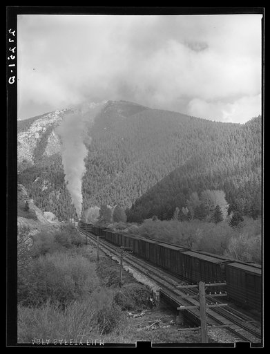 Untitled photo, possibly related to: Northern Pacific freight train going over Bozeman Pass. Gallatin County, Montana