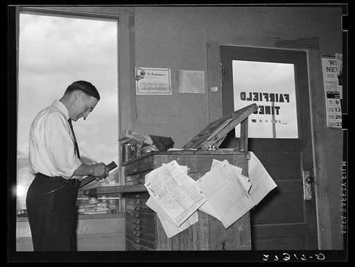 Editor of Fairfield Times setting type. Fairfield. Montana