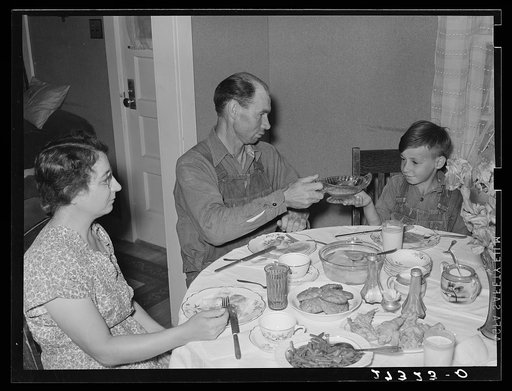 Farm family at dinner. Fairfield Bench Farms, Montana