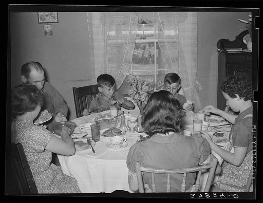 Farm family at dinner. Fairfield Bench Farms, Montana