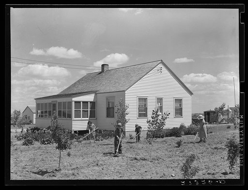 Farmer's wife and children in garden. Fairfield Bench Farms, Montana
