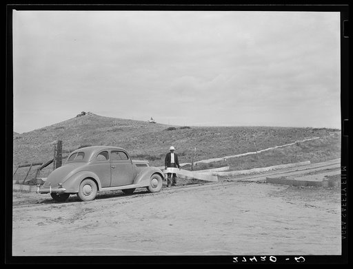 Cricket fence barricades a road. Big Horn County, Montana