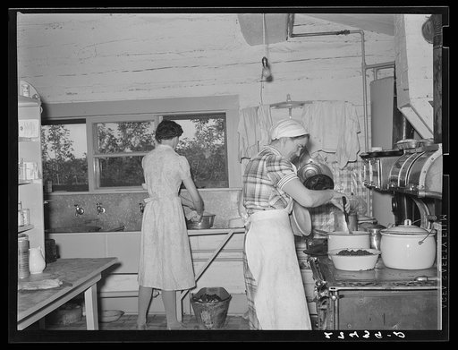 Cook and hired girl in kitchen. Quarter Circle 'U' Ranch, Montana