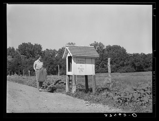 Rancher's wife at mailbox. Quarter Circle U Ranch, Montana