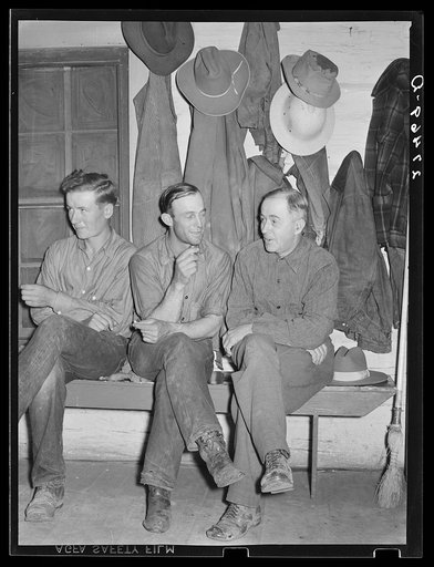 Untitled photo, possibly related to: Cowhands waiting for call to dinner. Quarter Circle 'U' Ranch, Montana