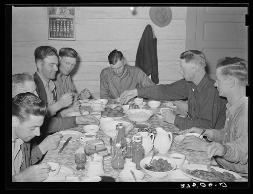Untitled photo, possibly related to: Cowhands at dinner. Quarter Circle 'U' Ranch, Montana