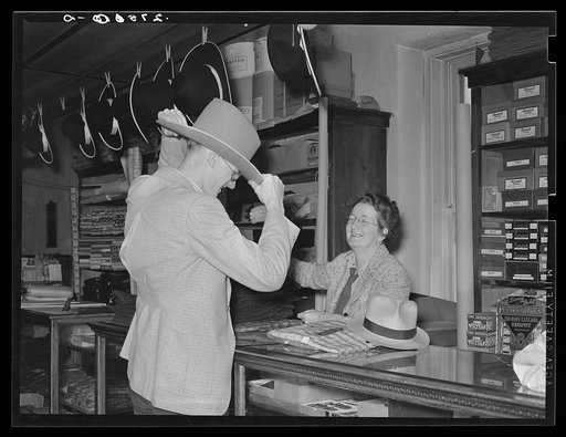 Making a sale in the general store. Birney, Montana