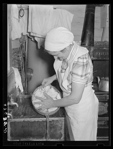 Cook with a pot of potatoes. Quarter Circle 'U' Ranch, Montana