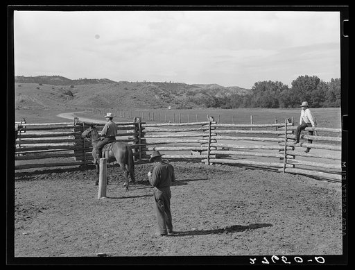 Untitled photo, possibly related to: Giving directions to visiting cowhand. Quarter Circle 'U' Ranch, Montana