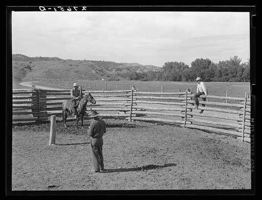 Untitled photo, possibly related to: Giving directions to visiting cowhand. Quarter Circle 'U' Ranch, Montana