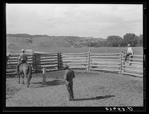 Untitled photo, possibly related to: Giving directions to visiting cowhand. Quarter Circle 'U' Ranch, Montana