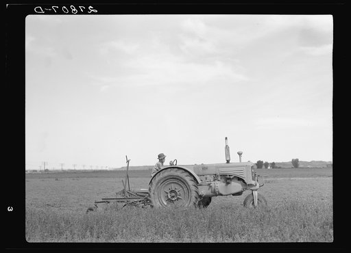 Tractor used in cutting alfalfa. Rosebud County, Montana