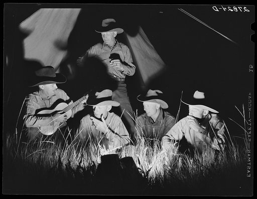 Cowhands singing after day's work. Quarter Circle 'U' Ranch roundup. Big Horn County, Montana