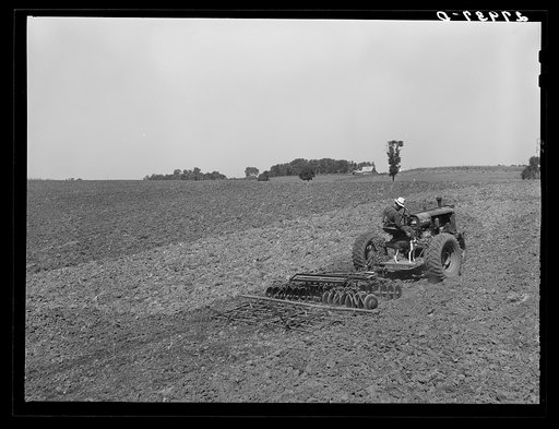 Untitled photo, possibly related to: Farmer pulling disc and harrow across plowed field. Kimberley farm, Jasper County, Iowa