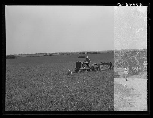 Untitled photo, possibly related to: Farmer pulling disc and harrow across plowed field. Kimberley farm, Jasper County, Iowa