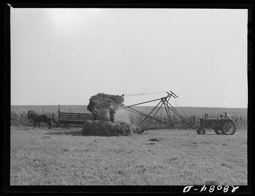 Untitled photo, possibly related to: Operating a jayhawk hayloader. Kimberley farm, Jasper County, Iowa
