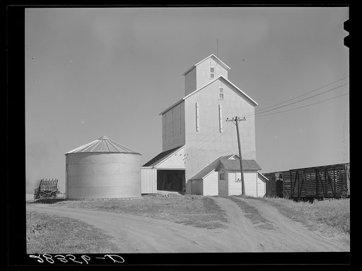 Untitled photo, possibly related to: Grain elevator with steel bin for shelled corn storage under ever-normal granary plan. Marshall County, Iowa