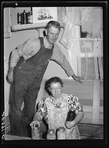 Mr. and Mrs. Milton Robinson, FSA (Farm Security Administration) borrowers, in their farmhouse near Greenley. Weld County, Colorado