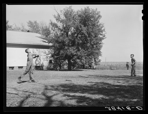 Untitled photo, possibly related to: Teacher supervises ball game during recess period. Grundy County, Iowa