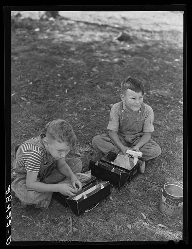 Children (pupils of one-room schoolhouse) eating lunch. Grundy County, Iowa