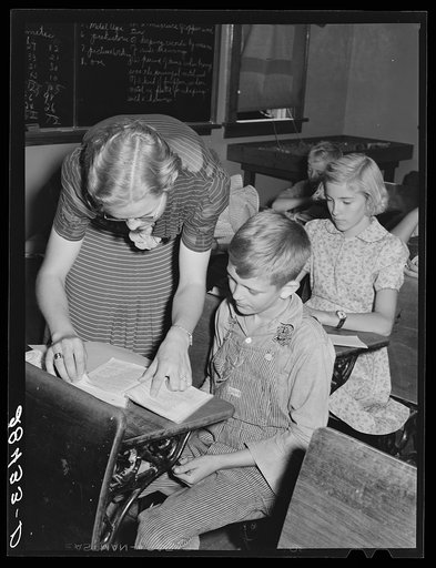 Lois Slinker and one of her pupils in one-room schoolhouse. Grundy County, Iowa