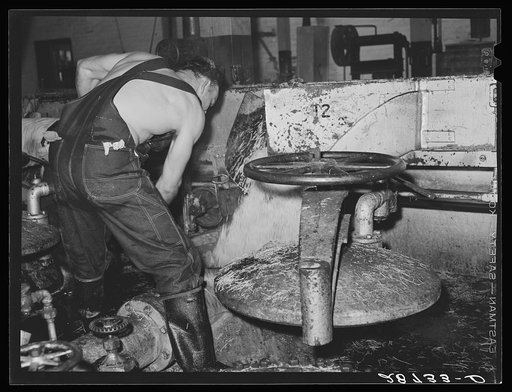 Untitled photo, possibly related to: Loading diffusion chamber with sugar beet pulp in factory at Brighton, Colorado