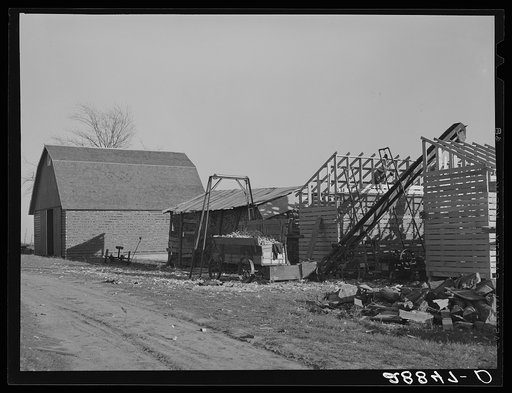 Farmer erects a new corn crib during harvest. Grundy Center, Iowa